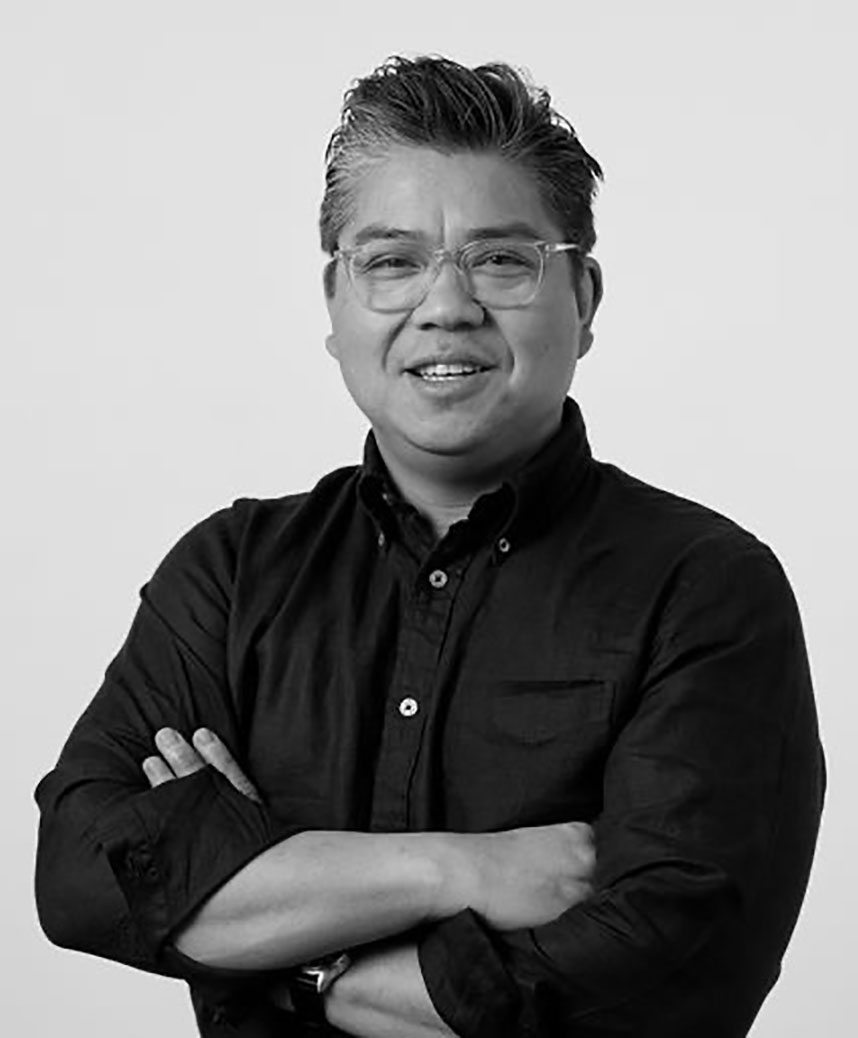 Black and white professional headshot of Erwin Tumangday
